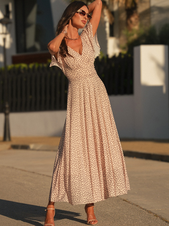 Nakrapiana beżowa sukienka z dekoltem w serek