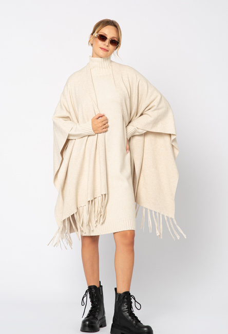 Beżowy sweter ponczo z frędzlami