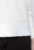 Wiskozowy sweter ecru z cekinowym pasem