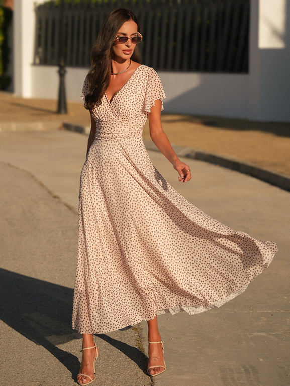 Nakrapiana beżowa sukienka z dekoltem w serek